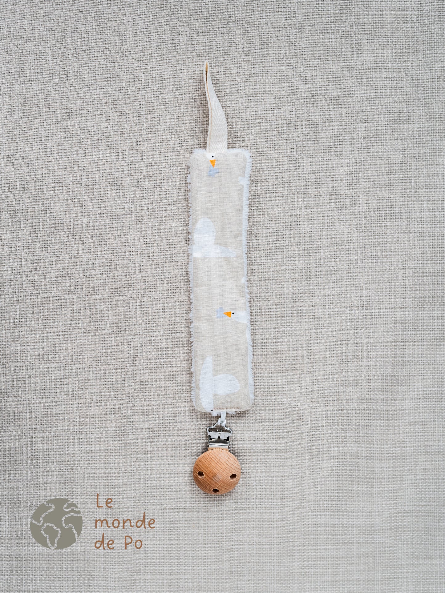 Attache tétine oies volantes