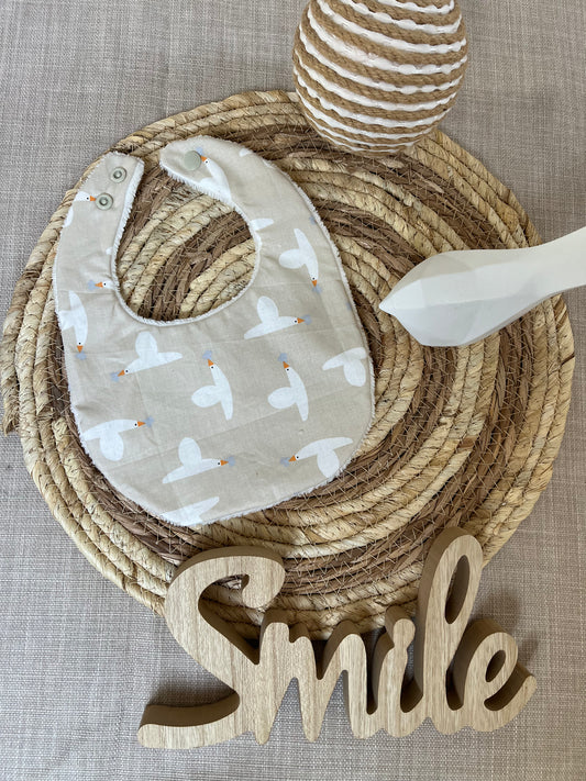 Bavoir oies volantes